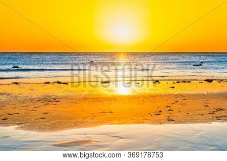 Sunset On Beautiful Sand Beach