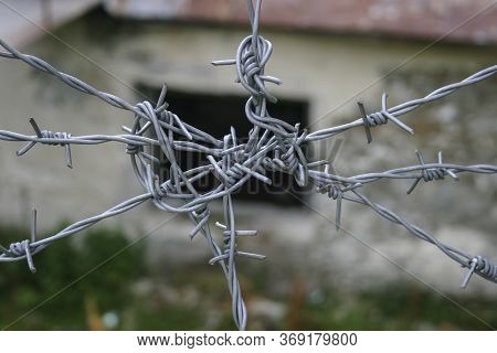 Closed Area. Barbed Wire, Danger. Passage Is Prohibited. A Blocked Path. Lawbreaker Pattern