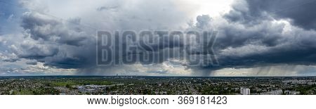 Panoramic View Dramatic Sky Over City. Far Village Sight Under Cloudy Sky. Aerial Flying Over Town, 