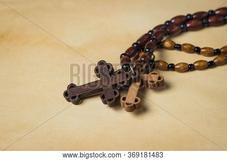 Religion Concept. Christian Religion. Two Wooden Crosses On Wooden Chains. One Cross Is Made Of Ligh