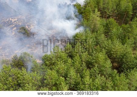 Aerial Drone View Of A Wildfire In Forested Area.