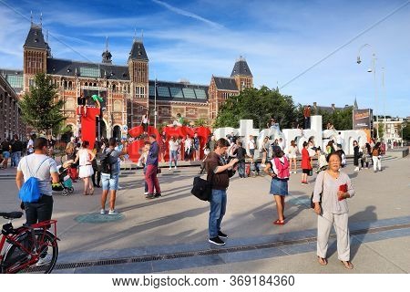 Amsterdam, Netherlands - July 9, 2017: People Visit Rijks Museum In Amsterdam. Amsterdam Is The Capi