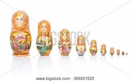 Group of Russian nesting dolls (also named as Matrioshka) isolated over white background. Wooden doll souvenir.