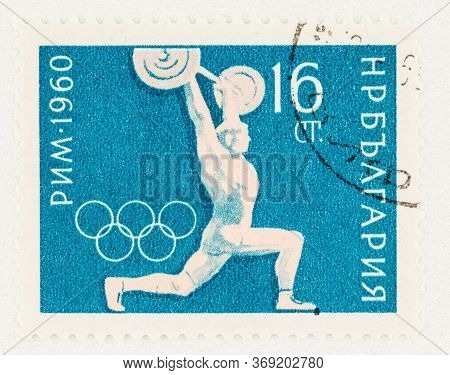 Seattle Washington - May 30, 2020: Weightlifting Event On 1960 Olympic Games Stamp Of Bulgaria.  Sco