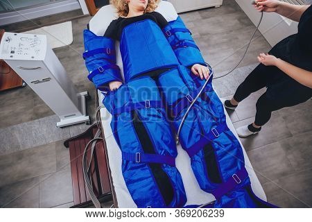 Pressotherapy Machine On Woman In Beauty Center