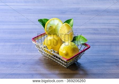 Supermarket Basket Carrying Green Leaf And Lemon