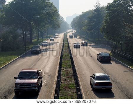 Boston - May 31, 2010: Cars And Trucks Roll Down Storrow Drive At Dusk In Boston, Massachusetts.