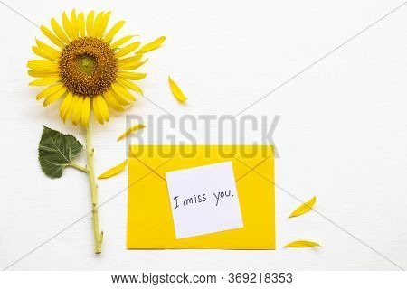I Miss You Message Card Handwriting In Yellow Envelope With Yellow Flower Sunflower Arrangement Flat