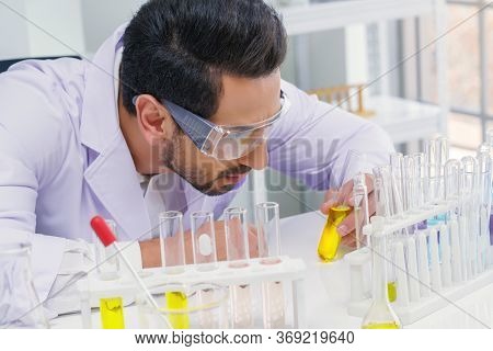 Doctor And Microbiologist With Vacuum Tubes For Samples With Covid 19 Infection Atypical Pneumonia V