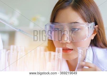 Doctor And Microbiologist With Vacuum Tubes For Samples With Covid 19 Infection Atypical Pneumonia V