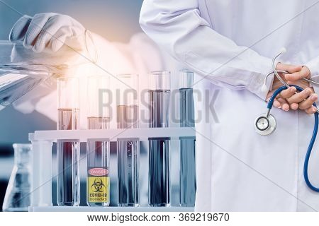 Doctor And Microbiologist With Vacuum Tubes For Samples With Covid 19 Infection Atypical Pneumonia V