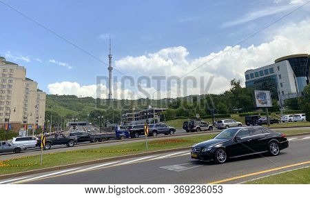 Almaty, Kazakhstan - June 1, 2020: Kok Tobe Telecommunication Tower And Buildings Along Dostyk Avenu