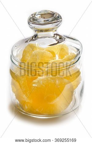 Dried Pineapple Candy Rings, In Powdered Sugar, Close-up Under Sunlight, Lying In A Transparent Glas