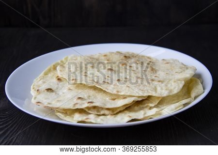 Delicious Pita Bread Made At Home In A Pan. Thin Pita Bread On A White Plate