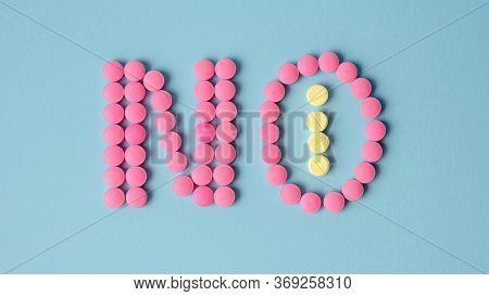 Pink Round Pills Forming The Word No