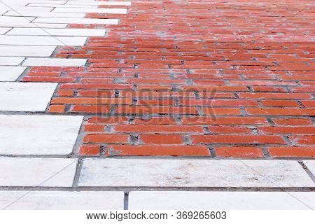 Brick Wall In Perspective. Detailed Close Up View On Red Brick Wall At Aged And Weathered Building, 