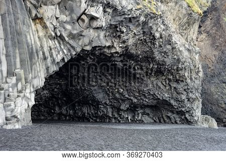 Halsanefshellir Cave In Iceland, Europe Near Vik I Myrdal Town On Black Sand Beach With Basalt Colum