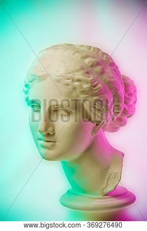 Statue Of Venus De Milo. Creative Concept Colorful Neon Image With Ancient Greek Sculpture Venus Or 