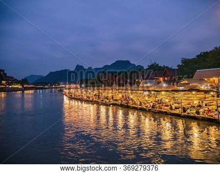 Vangvieng/lao-4 Dec 2017:beautiful View Of Nam Song River With Riverside Restaurant And The Mountain