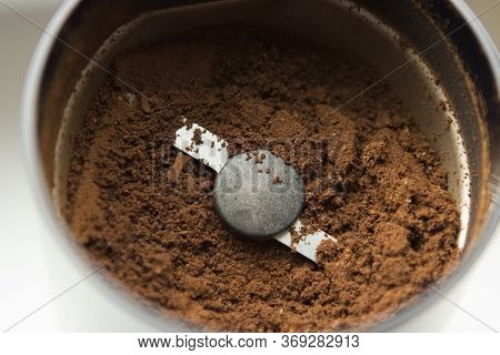 Coffee Beans Ground In An Electric Black Coffee Grinder