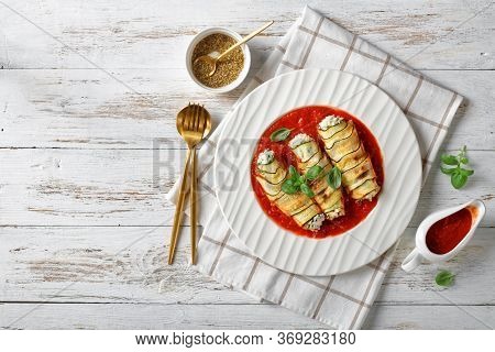 Italian Appetizer: Zucchini Rollatini Filled With Ricotta, Garlic And Spinach Baked In Tomato Sauce,
