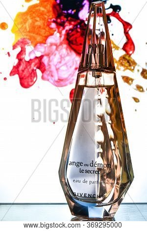 Zhytomyr, Ukraine - June 2, 2020. A Clear Orange Glass Spray Bottle Of Givenchy Ange Ou Demon Le Sec