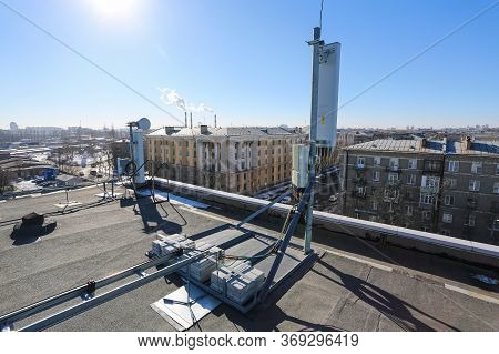 Russia, Saint-petersburg - April 30, 2018: Panel Antenna Of 5g, 4g, 3g, 2g Bands, Optical Fibers, Po