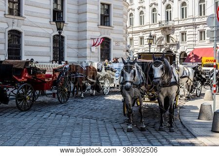 Vienna, Austria - June 18, 2018: Horse Drawn Carriages In From Of St. Michael's Wing, Vienna Old Tow