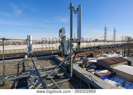 Russia, Saint-petersburg - April 30, 2018: Panel Antenna Of 5g, 4g, 3g, 2g Bands, Optical Fibers, Po
