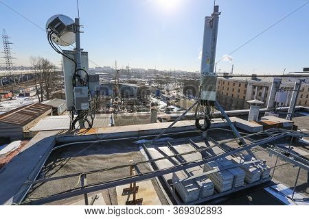 Russia, Saint-petersburg - April 30, 2018: Panel Antenna Of 5g, 4g, 3g, 2g Bands, Optical Fibers, Po