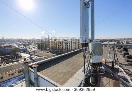 Russia, Saint-petersburg - April 30, 2018: Panel Antenna Of 5g, 4g, 3g, 2g Bands, Optical Fibers, Po