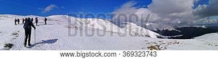 Iezer Mountains, Romania -  February 28, 2020: Hiking In The Mountains  During Winter
