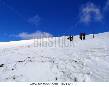 Iezer Mountains, Romania -  February 28, 2020: Hiking In The Mountains  During Winter