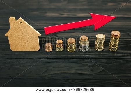 Concept Of Home Sales, Real Estate, Mortgage Lending, Inflation. Layout Of A House And A Stack Of Eu