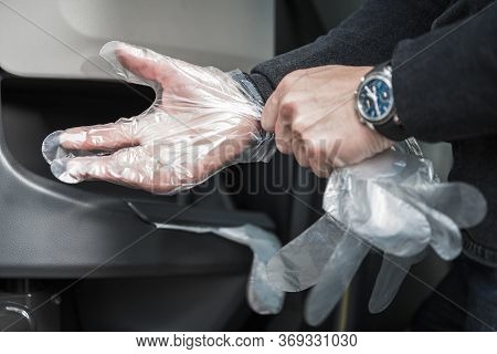 Caucasian Men Wearing Disposable Transparent Vinyl Gloves. Covid Virus Outbreak Necessary Steps. Hea