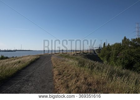 Asphalt Road Along The Bank Of The Scheldt