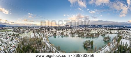 Aerial Drone Shot View Of Leopoldskroner Lake Southwest Of Outskirts Of Salzburg During Winter