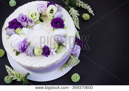 Beautiful Purple Cake Decoraited Of  Fresh Flowers, Macaroons And Meringue. Heart Cake. Love Concept