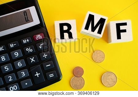 Text Rmf For Retirement Mutual Fund Made From Wooden Blocks With Pile Of Coins Spilling Out Of Glass