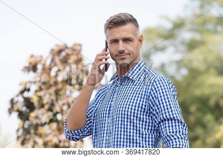 Standing By For A Call. Handsome Man Make Phone Call Outdoors. Call Answering. Incoming Call. Phone 