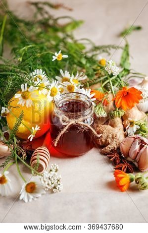 Jar Of Organic Honey, Lemon, Garlic Root, Anise, Fresh Flowers Camomile And Calendula. Concept Of Al