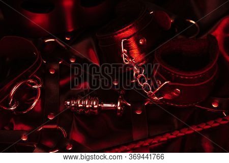 Set Of Accessories For Bdsm Sex With Handcuffs, Anal Plug, Flogger
