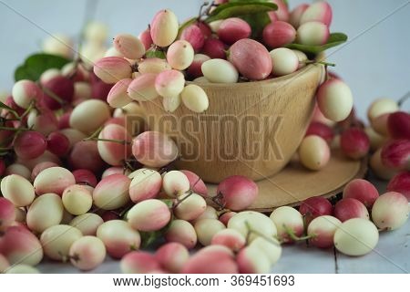 Karanda Plum Or Koromcha Fruits In Wooden Cup
