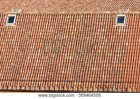 Pantiles. Closeup Of An Old House Roof With Tiles Made From Clay (coppo In Italian Language), And Sk