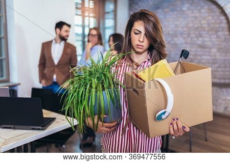 Business Woman Carrying Packing Up All His Personal Belongings And Files Into A Brown Cardboard Box 