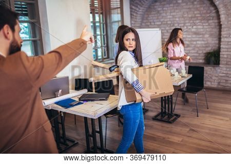 Business Woman Carrying Packing Up All His Personal Belongings And Files Into A Brown Cardboard Box 