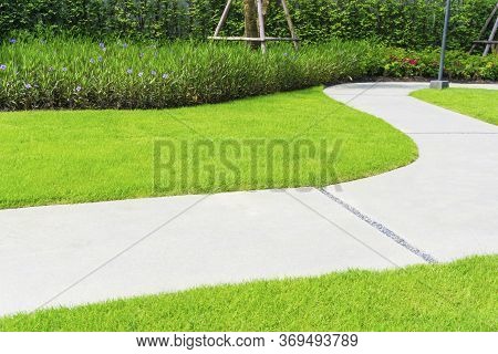 The Gray Curve Pattern Walkway In A Beautiful Garden, Sand Washed Finishing On Concrete Paving, A Sm