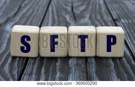Concept Word Sftp On Cubes On A Dark Wooden Background