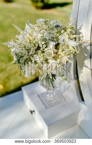 White Luxurious Wedding Bouquet Of Lilies Of The Valley, Astilba, Astrantia And Sweet Peas On White 