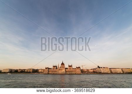 Budapest Parliament Building At Sunset Golden Time With Blue And Danube River, Hungary